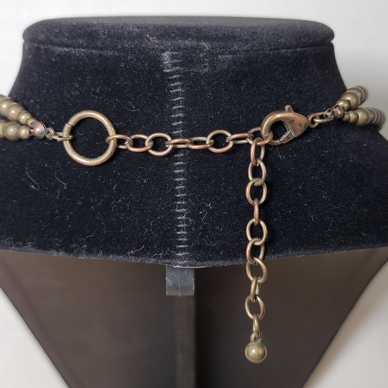 Multi-Strand Beaded Necklace w/ an Antiqued Gold-Tone Pendant